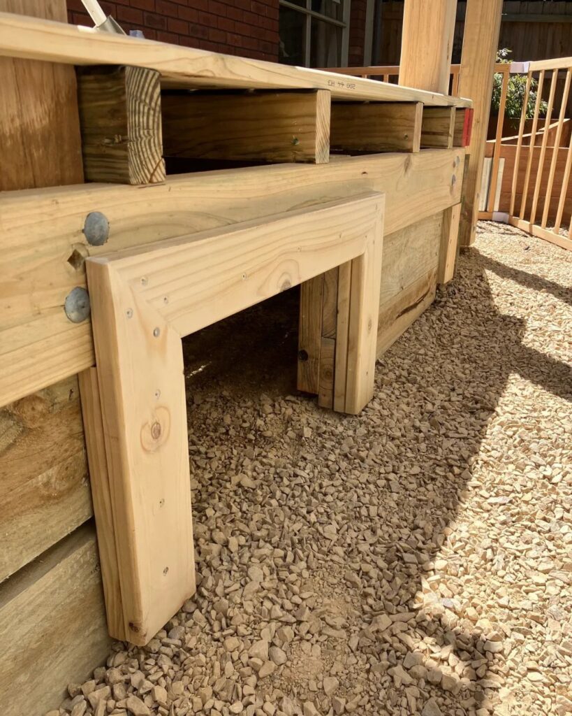 Custom under-deck access door built by Bayside deck builder in Heathmont, designed for pet-friendly backyard use and easy maintenance access