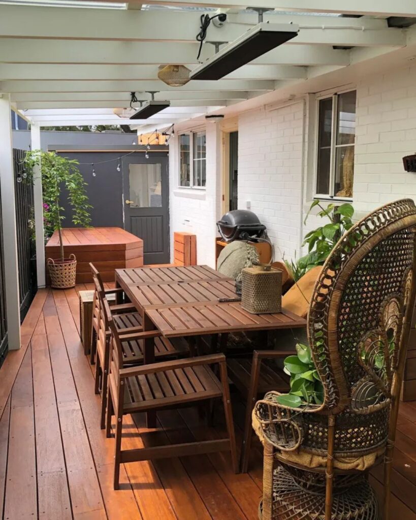Black Rock timber deck with spa cover and outdoor entertainment space, custom-built by Bayside deck builder.